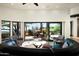 Living room with views, fireplace and access to patio at 42035 N 113Th Way, Scottsdale, AZ 85262