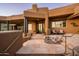Exterior of home with stone accents and entrance at 42035 N 113Th Way, Scottsdale, AZ 85262