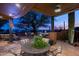 Spacious patio with seating, dining, and built-in grill at 42035 N 113Th Way, Scottsdale, AZ 85262