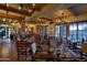 Rustic-chic dining room with warm lighting and comfortable seating at 42035 N 113Th Way, Scottsdale, AZ 85262
