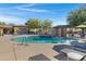 Community pool with spa and surrounding lounge area at 15240 N 142Nd Ave # 2111, Surprise, AZ 85379