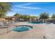 Community pool and spa with lounge chairs and umbrellas at 15240 N 142Nd Ave # 2111, Surprise, AZ 85379
