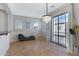 Bright dining area with chandelier, patio doors, and seating at 15240 N 142Nd Ave # 2111, Surprise, AZ 85379
