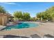Community pool with spa, lounge chairs and a pergola at 15240 N 142Nd Ave # 2111, Surprise, AZ 85379