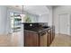Kitchen island with granite countertop and stainless steel dishwasher at 15240 N 142Nd Ave # 2111, Surprise, AZ 85379