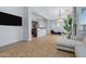 Open living room with a view of the kitchen and access to other rooms at 15240 N 142Nd Ave # 2111, Surprise, AZ 85379