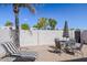 Relaxing patio with seating area, umbrella, and lounge chair at 7668 E Pleasant Run --, Scottsdale, AZ 85258