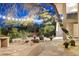 Peaceful courtyard with stone pathway, fountain, and string lights at 8420 N 15Th St, Phoenix, AZ 85020