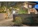 Night view of home exterior showcasing architectural details and landscaping at 8420 N 15Th St, Phoenix, AZ 85020