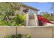 Two story home with stucco exterior, landscaping, and stairs at 8420 N 15Th St, Phoenix, AZ 85020