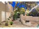 Charming backyard patio with string lights, flagstone, and lush landscaping at 8420 N 15Th St, Phoenix, AZ 85020