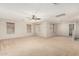 Bright and airy living room with neutral carpeting at 4386 E Selena Dr, Phoenix, AZ 85050