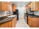 Well-equipped kitchen with wood cabinets and granite countertops at 6900 E Princess Dr # 1136, Phoenix, AZ 85054