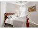 Well-lit bedroom with wooden sleigh bed and neutral decor at 6900 E Princess Dr # 1136, Phoenix, AZ 85054