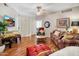 Living room with hardwood floors, comfortable seating and access to patio at 6900 E Princess Dr # 1136, Phoenix, AZ 85054