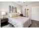 Bright bedroom with patterned bedding and ensuite bathroom at 6900 E Princess Dr # 1136, Phoenix, AZ 85054