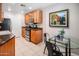 Modern kitchen with wood cabinets, granite counters, and stainless steel appliances at 6900 E Princess Dr # 1136, Phoenix, AZ 85054