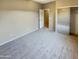 Bedroom with mirrored closet doors and carpet at 13049 W Redbird Rd, Peoria, AZ 85383