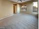 Bright and airy bedroom with neutral carpeting and large windows at 13049 W Redbird Rd, Peoria, AZ 85383