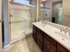 Double vanity bathroom with large walk-in shower at 13049 W Redbird Rd, Peoria, AZ 85383
