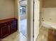 Bathroom with tub, shower, and dark wood vanity at 13049 W Redbird Rd, Peoria, AZ 85383