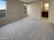 Spacious carpeted bedroom with large windows and ensuite bathroom at 13049 W Redbird Rd, Peoria, AZ 85383