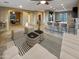 Open living room, kitchen, and dining area with tile floors at 13049 W Redbird Rd, Peoria, AZ 85383