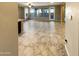 Spacious living room with tile floors and large windows at 13049 W Redbird Rd, Peoria, AZ 85383