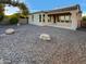 Landscaped backyard with patio and gravel covering at 13049 W Redbird Rd, Peoria, AZ 85383