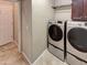Bright laundry room with Samsung washer and dryer at 13049 W Redbird Rd, Peoria, AZ 85383