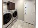 Laundry room with washer, dryer, and cabinets at 13049 W Redbird Rd, Peoria, AZ 85383