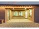 Covered patio with string lights and double doors leading to the interior at 2236 W Aston Dr, Queen Creek, AZ 85144