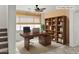 Virtually staged home office with built-in shelving at 3211 E Kerry Ln, Phoenix, AZ 85050