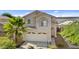 Two-story house exterior with a two-car garage and landscaping at 3211 E Kerry Ln, Phoenix, AZ 85050