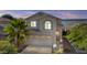Two story house with tan exterior, two car garage and landscaping at 3211 E Kerry Ln, Phoenix, AZ 85050