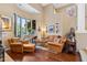 Bright living room with a cozy seating area and hardwood floors at 26348 N 104Th Way, Scottsdale, AZ 85255