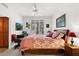 Spacious bedroom with a king-size bed and a writing desk at 26348 N 104Th Way, Scottsdale, AZ 85255