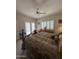 Bedroom with a king-size bed and access to a patio at 26348 N 104Th Way, Scottsdale, AZ 85255