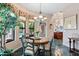 Charming breakfast nook with a wooden table and chairs, offering abundant natural light at 26348 N 104Th Way, Scottsdale, AZ 85255