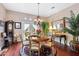 Elegant dining room with hardwood floors and a chandelier at 26348 N 104Th Way, Scottsdale, AZ 85255