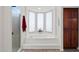 Bathroom features a built-in tub, wood cabinets, and a walk-in shower at 26348 N 104Th Way, Scottsdale, AZ 85255