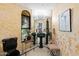 Elegant bathroom with black pedestal sink and gold accents, featuring a large framed portrait at 26348 N 104Th Way, Scottsdale, AZ 85255