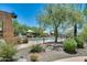 Community lap pool with lounge chairs at 2140 W Tallgrass Trl # 208, Phoenix, AZ 85085