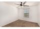 Bedroom with ceiling fan and neutral carpeting at 7311 N 90Th Ave, Glendale, AZ 85305