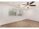 Bright bedroom with ceiling fan and window coverings at 7311 N 90Th Ave, Glendale, AZ 85305