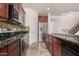 Modern kitchen with stainless steel appliances and granite countertops at 7311 N 90Th Ave, Glendale, AZ 85305