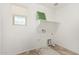 Laundry room with shelving and window at 7311 N 90Th Ave, Glendale, AZ 85305