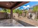 Covered patio with flagstone flooring, fountain, and sitting area at 7311 N 90Th Ave, Glendale, AZ 85305