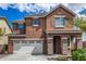 Two-story house with a two-car garage and landscaping at 7311 N 90Th Ave, Glendale, AZ 85305