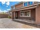 Covered patio with flagstone flooring, extending from the house at 7311 N 90Th Ave, Glendale, AZ 85305